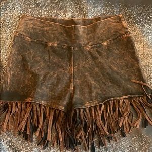Brown fringe shorts.